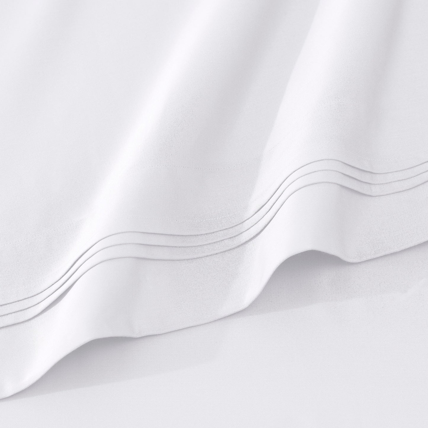 Jeu de draps uni en coton égyptien supérieur, 1000 fils, avec poche profonde.