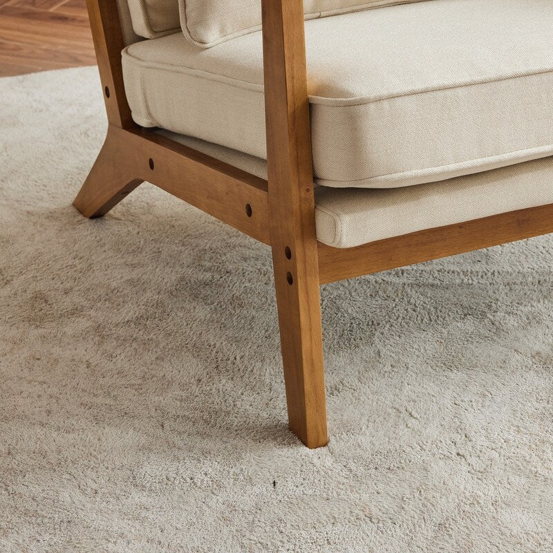 Fauteuil d'appoint en lin mélangé avec pieds en bois et un coussin beige.