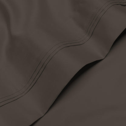 Jeu de draps uni en coton égyptien supérieur, 1000 fils, avec poche profonde.