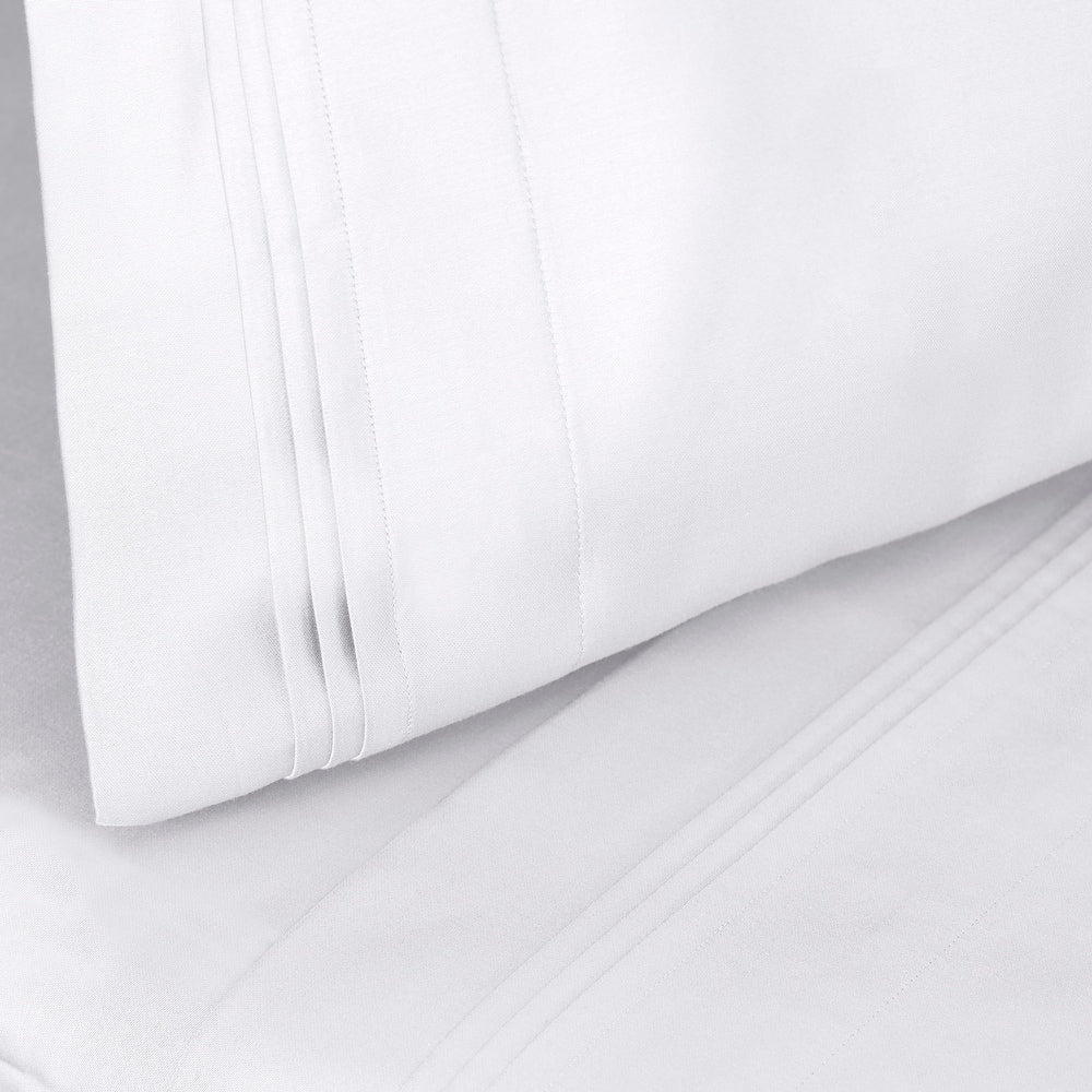 Jeu de draps uni en coton égyptien supérieur, 1000 fils, avec poche profonde.