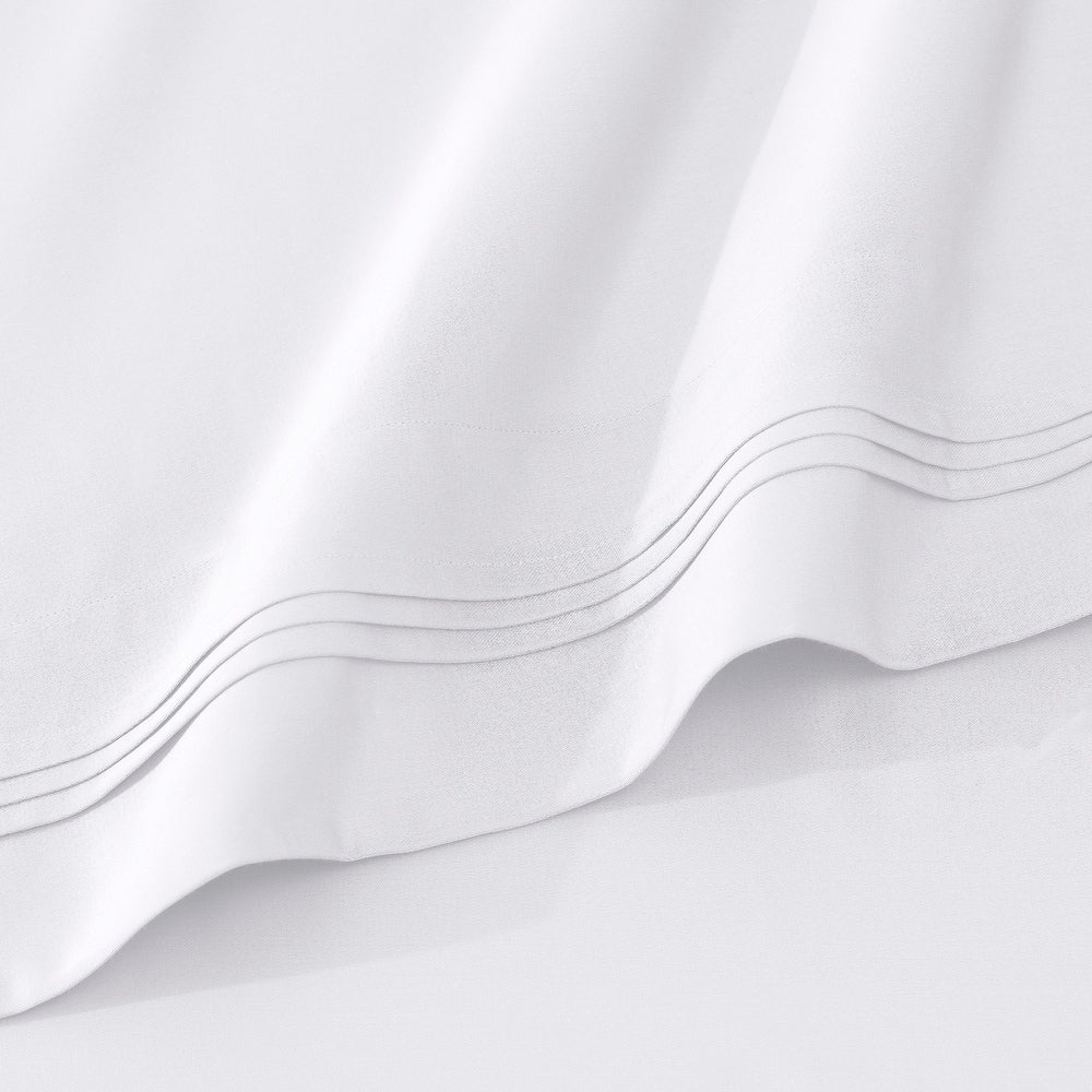 Jeu de draps uni en coton égyptien supérieur, 1000 fils, avec poche profonde.