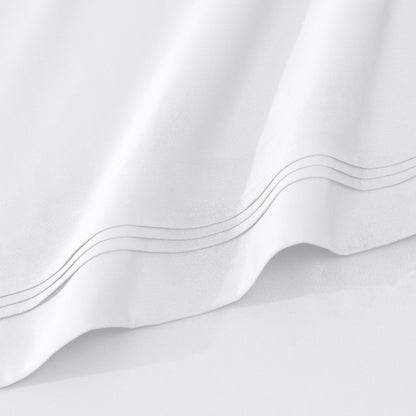 Jeu de draps uni en coton égyptien supérieur, 1000 fils, avec poche profonde.
