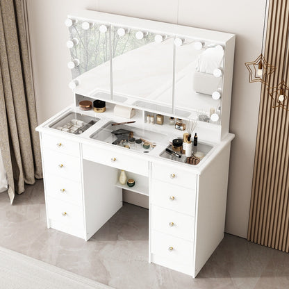 Coiffeuse avec miroir à trois volets, éclairage certifié et plateau en verre.