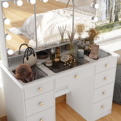 Coiffeuse avec miroir à trois volets, éclairage certifié et plateau en verre.