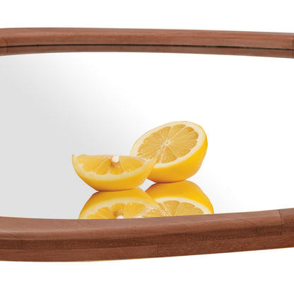 Miroir mural asymétrique en forme de galet avec cadre en pin.