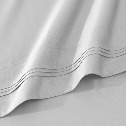 Jeu de draps uni en coton égyptien supérieur, 1000 fils, avec poche profonde.