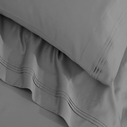 Jeu de draps uni en coton égyptien supérieur, 1500 fils, avec profonde poche.
