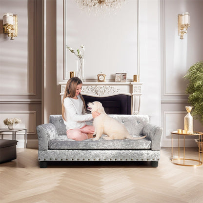 Lit pour animaux de compagnie en forme de canapé en velours capitonné, recouvert de tissu et doté d'un coussin amovible.