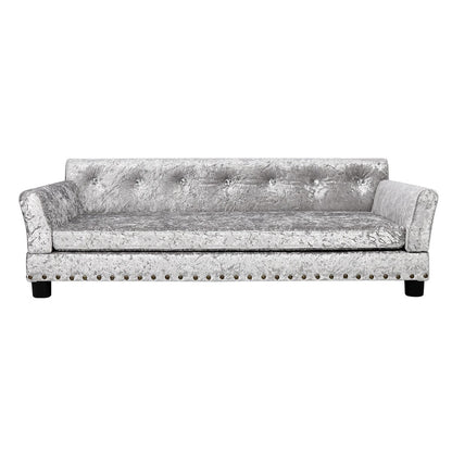 Lit pour animaux de compagnie en forme de canapé en velours capitonné, recouvert de tissu et doté d'un coussin amovible.
